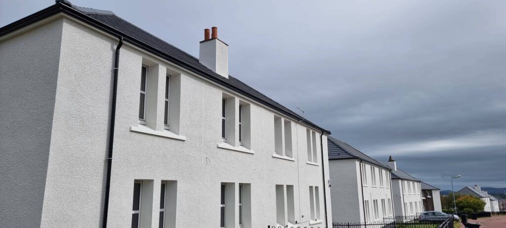 Social housing terrace with seamless gutters